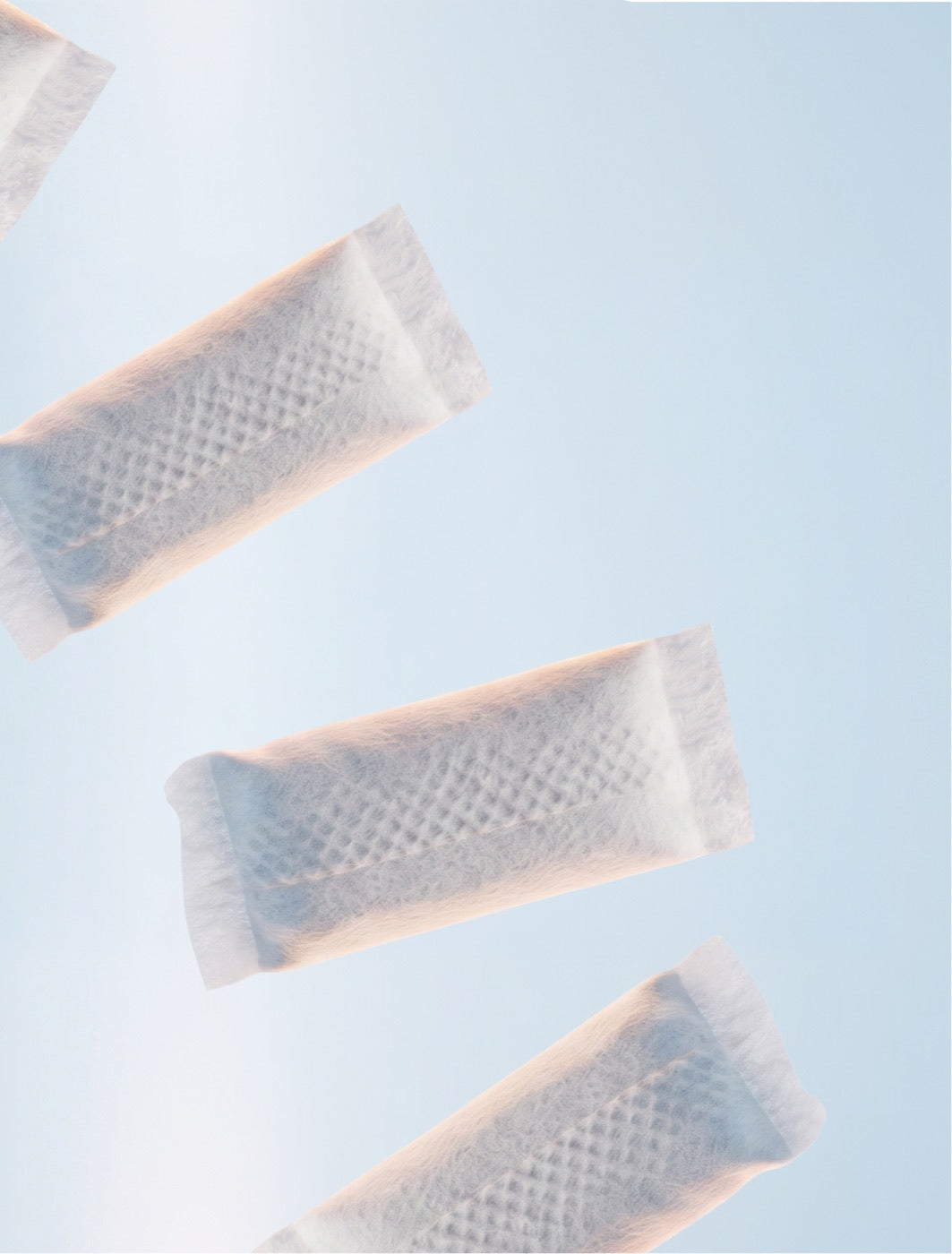 SZN pouches against a pale blue ground